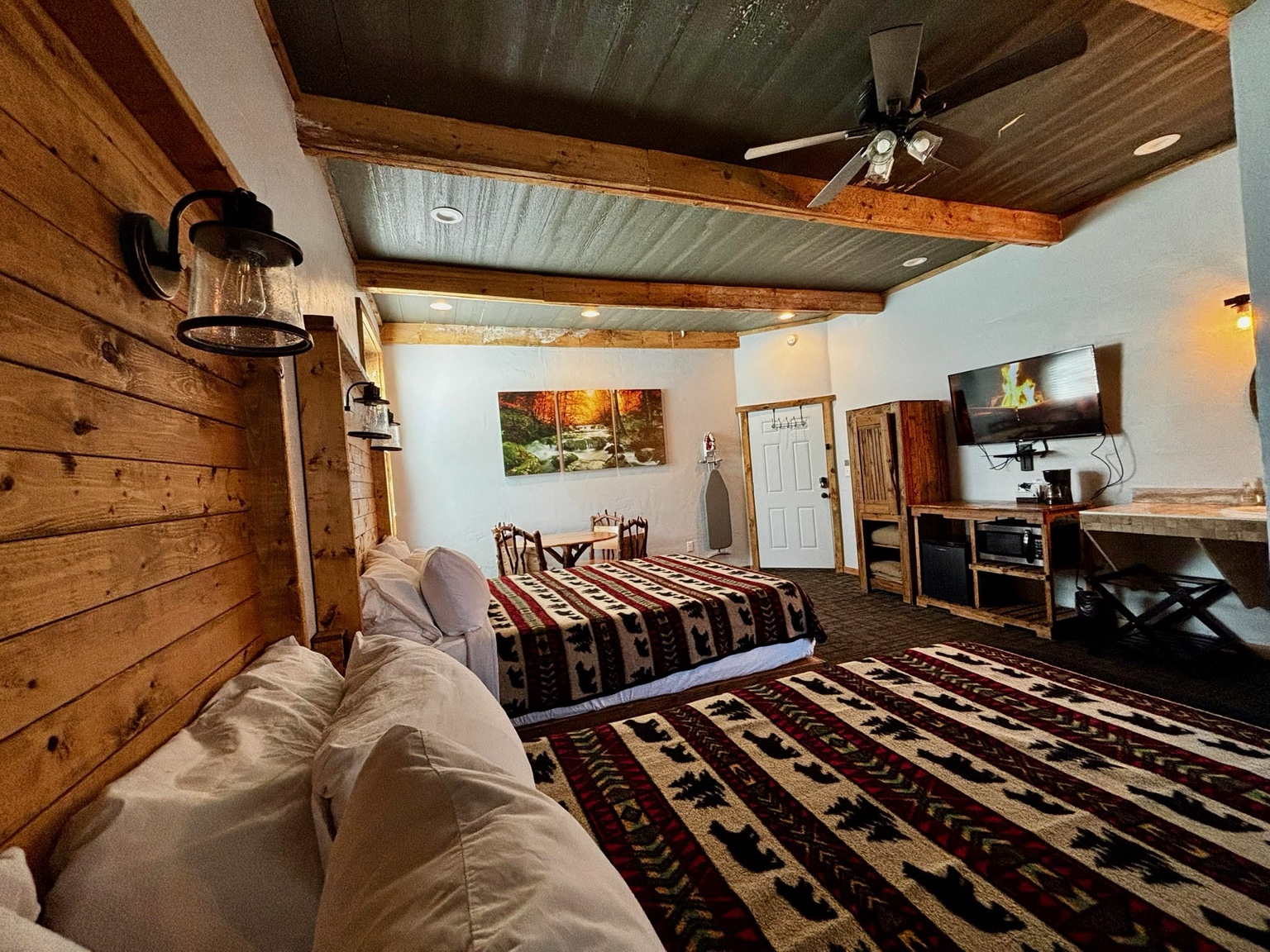 Room 104 with two queen beds and dining table